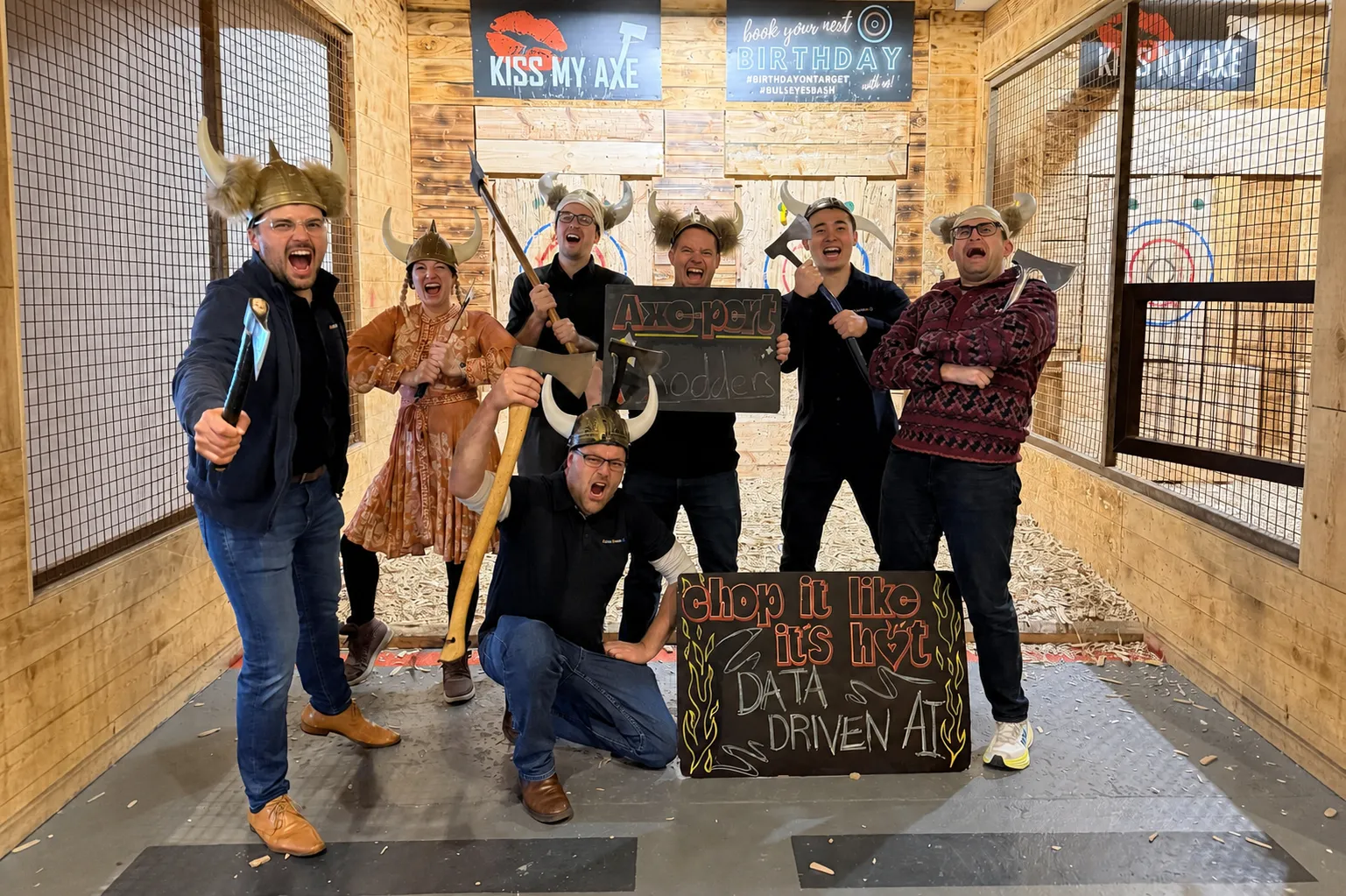 The Data-Driven AI team at an axe-throwing event